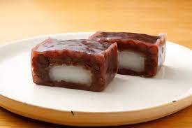 Tradycyjne mochi z Kusatsu 53 Stacje Tokkaido autorstwa Utagawy Hiroshige (ukiyo-e): motyw drogi w Japonii ery Edo, analiza wybranych drzeworytów