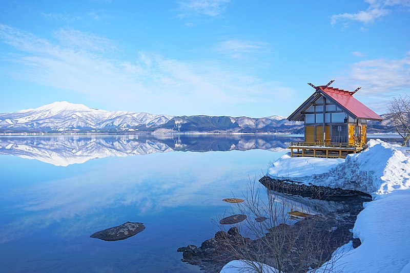 Snowy mountains and clear water lakes in Akita, Japan. Article about Japanese New Year's customs from remote snowy Akita - Namahage. Dark Namahage presence in New Year's day, their history, mythology behind it and role in modern Japan, manga, anime and video games.