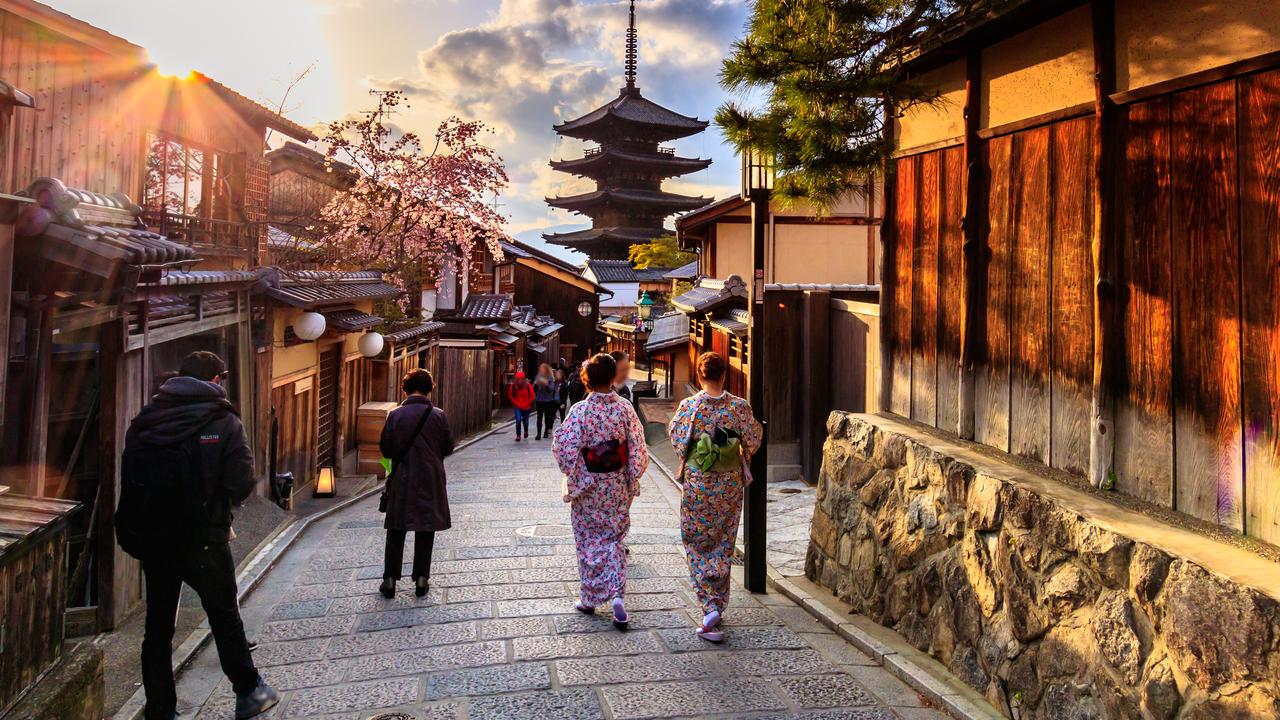Kyoto, Gion district - district of the most exclusive geishas in Japan. Article about 20 century most famous geisha Mineko Iwasaki. Geishas as artisans and keepers of Japanese culture and tradition. Mineko Iwasaki standing against Arthur Golden regarding defamation case in Memoirs of Geisha.