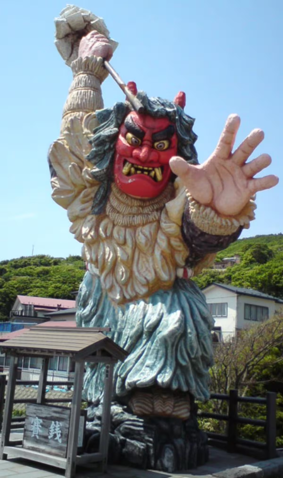 Namahage sculpture, Akita, Japan. Article about Japanese New Year's customs from remote snowy Akita - Namahage. Dark Namahage presence in New Year's day, their history, mythology behind it and role in modern Japan, manga, anime and video games.