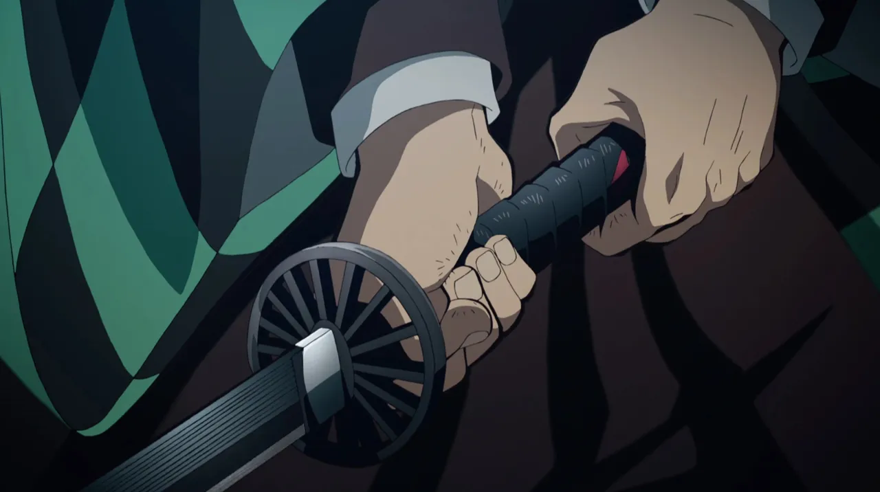 Demon Slayer: Kimetsu no Yaiba - tsuba w japońskim anime Esej / asrtykuł o Tsuba - sztuce rzemieślniczej wytwarzania osłon rękojeści mieczy katana. Rola Tsuby w historii i wykorzystanie tego motywu w japońskich