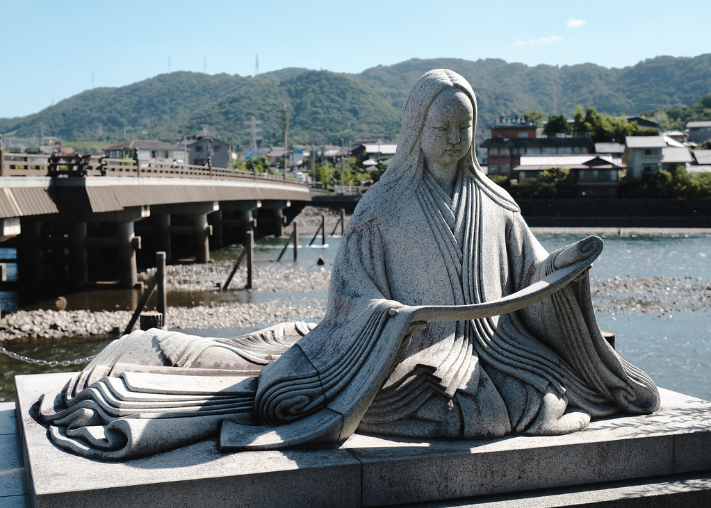 Murasaki shikibu's statue in Japan. Essay about Murasaki Shikibu - female author of the first novel in the world, from ancient Japan in Heian jidai. Women in Japanese literature.
