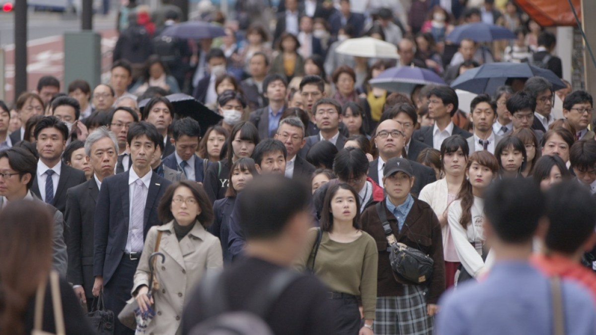 Busy street of Tokyo, Japan - jouhatsu takes over 80000 of Japanese people every year. Article-essay about a jouhatsu phenomenon in contemporary Japan. People evaporating, disappearing from Japanese society. Next social problem plaguing Japan after hikikomori, suicide and low birth rate.