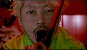 Kakihara cutting off his tongue, ichi the Killer, Japan. Article about the movie "Koroshiya Ichi" ("Ichi the Killer" by Takashi Miike based on Japanese manga by Hideo Yamamoto "Ichi the Killer". Kakihara, Ichi, Jiiji, Jiro and Saburo and more.