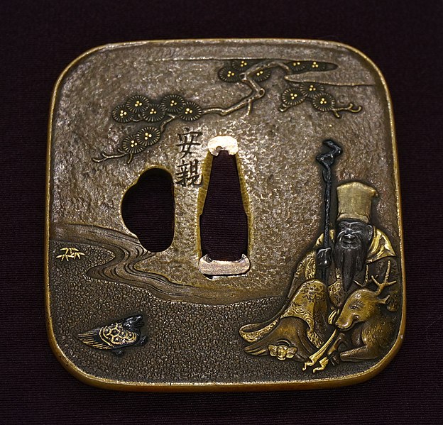 Historia Japonii - czym jest tsuba w katanie samuraja? Esej / asrtykuł o Tsuba - sztuce rzemieślniczej wytwarzania osłon rękojeści mieczy katana. Rola Tsuby w historii i wykorzystanie tego motywu w japońskich