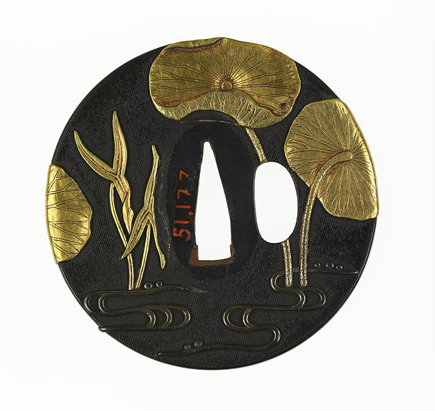 Historia Japonii - tsuba to element katany, miecza samuraja. Esej / asrtykuł o Tsuba - sztuce rzemieślniczej wytwarzania osłon rękojeści mieczy katana. Rola Tsuby w historii i wykorzystanie tego motywu w japońskich